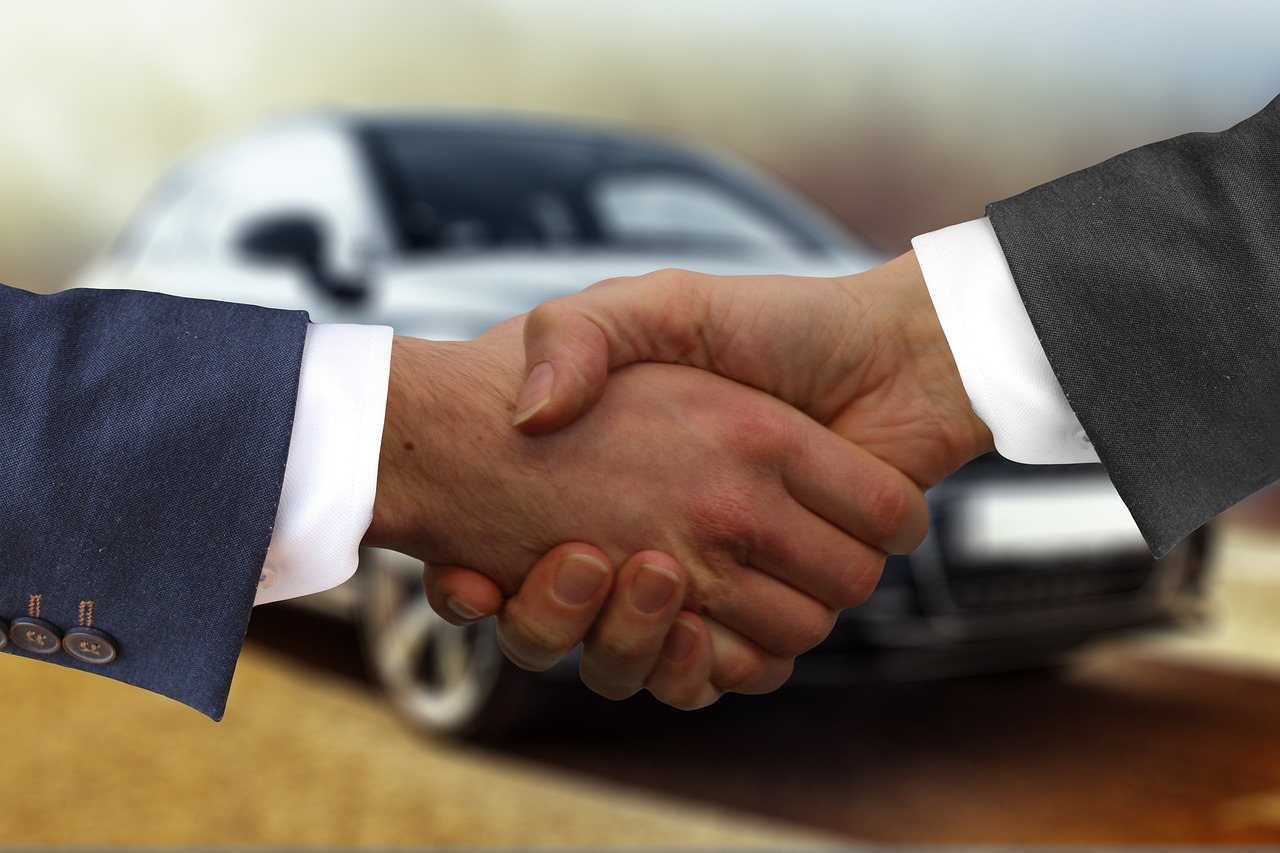 Shaking hands on a car deal with RCK Cars