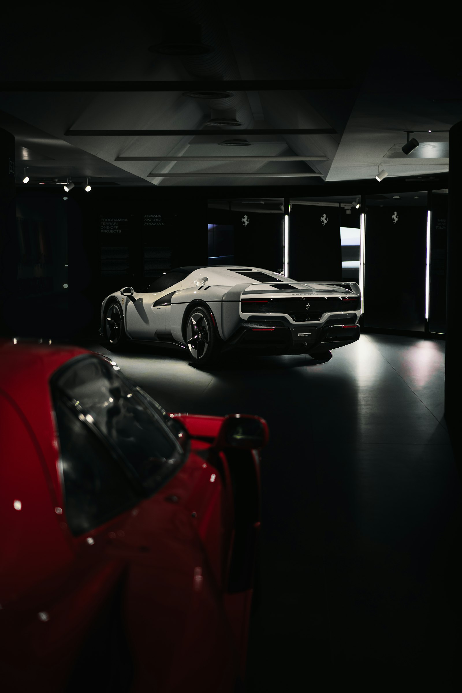 Supercars in a dark showroom